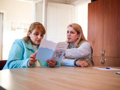 Elena from World Vision Georgia introducing health services to Nino from Samtskhe-Javakheti 