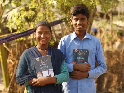 A girl and a boy smiling