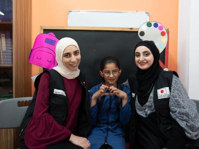 Dana happily posing with her teachers World Vision Syria Response, Joanna Zreineh