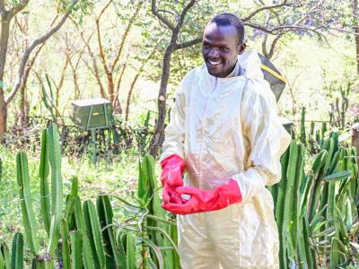 Richard Mnang’at is a 29-year-old lead farmer who is economically empowered thanks to his recently acquired beekeeping skills. ©World Vision Photo/ Hellen Owuor