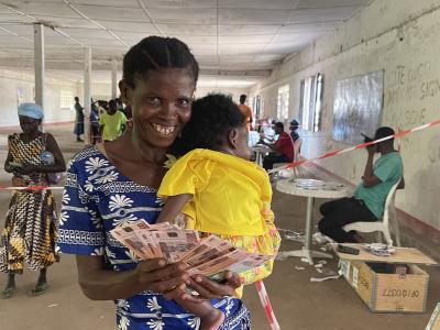 A women after receiving a financial support from World Vision