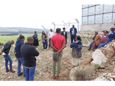 Officials from World Bank interacting with water committee members at a World Vision supported water project site. 