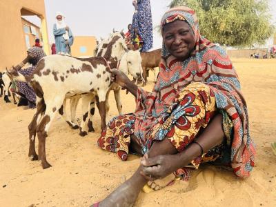 Woman with her goat. 