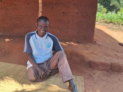 Here, Dinis takes a photo after a conversation over his work with a World Vision staff.