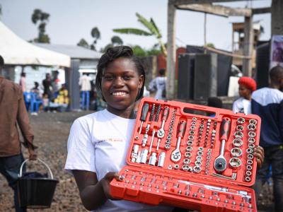 Immaculee, posing with her tool box