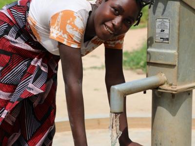 16-year-old Dina's life was transformed by new water source that was installed in her community in the north of Mozambique by World Vision and funded by UK.