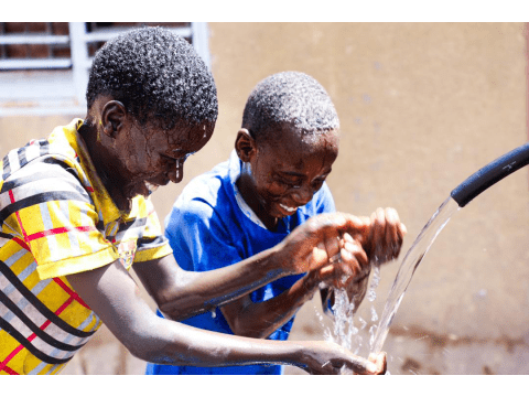Two children enjoying water