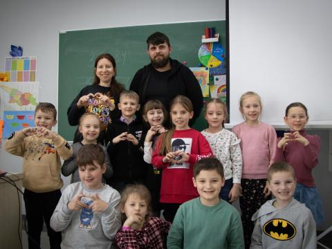 students with their teacher at school