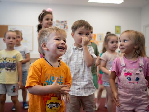 Learning Roots Image, child enjoying activities in a classroom