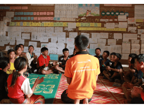 Unlock Literacy, World Vision trained facilitator helps children improve their reading skills