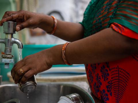 Indian woman with clean water