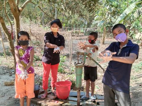 Children teaching other hand-washing 