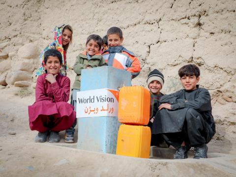 Children with Jerry cans of clean water in Afghanistan