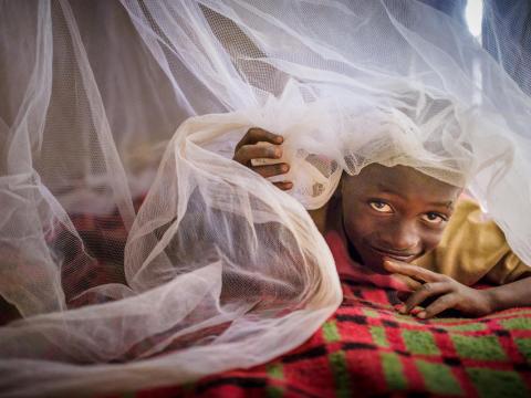 Steven in Zambia no longer suffers from malaria now he has a mosquito net.