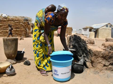 Maria uses the bucket she received for cooking