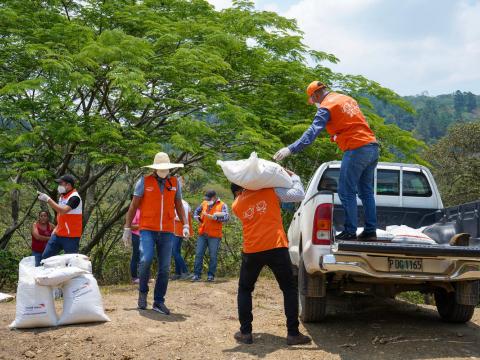 World Vision stff unload supplies from a truck