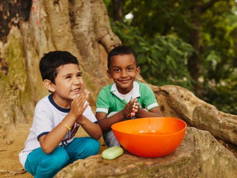 sponsored children wash their hands