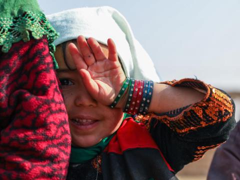 Girl covering her face in Afghanistan