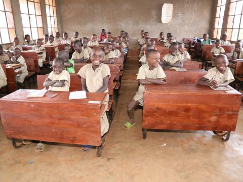 Today, Jeannette and her classmates enjoy learning whilst sitting on a desk