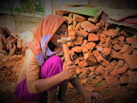 Child labourer Nuri in Bangladesh breaks bricks to earn money for her family.