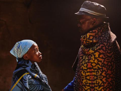 A father looking at his child- child marriage context.