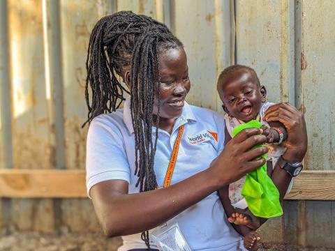 WV South Sudan Ajio Bridget holding a baby