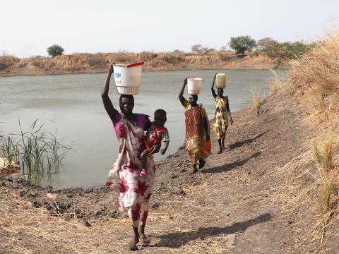 Group of women fetchng water