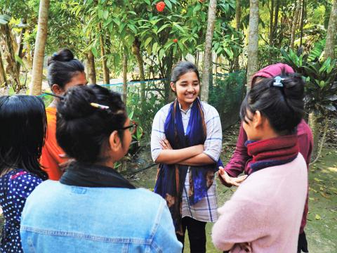 a group of adolescents talking