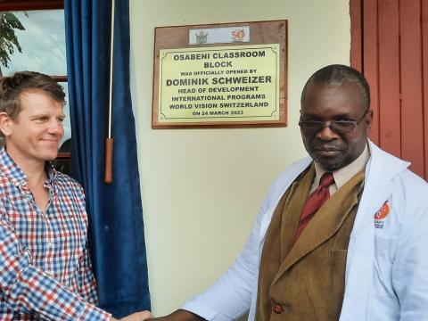 World Vision Switzerland Head of International Programs Dominik Schweizer with Mangwe District Schools Inspector Danisa Nkomo