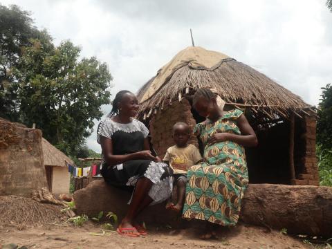 CHW with pregnant woman and 2 yr old son South Sudan