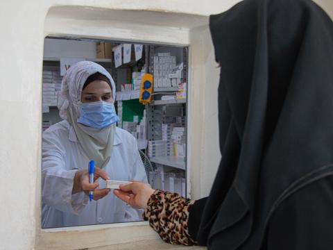 Amira receiving her medications. 