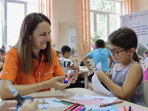 Ukraine Crisis Response Staff with a child