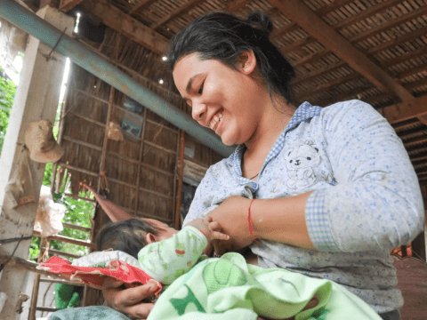 Women nursing baby