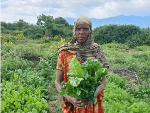 Woman holding agricultural produce