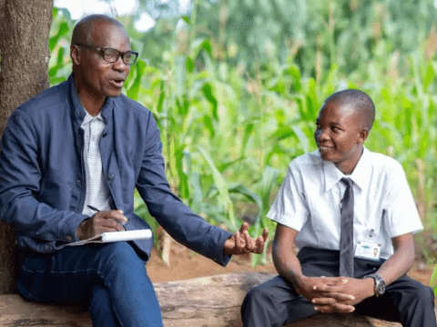 man and boy sitting