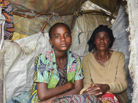 Ornella and her mother pose for the camera in an IDP camp in North Kivu