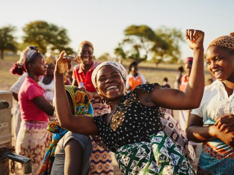 woman dancing happily