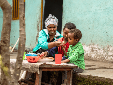 Hindiya feeds her sons at her house 