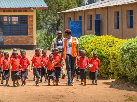 WV Rwanda Staff with Children