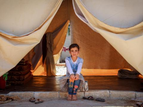 Syrian refugee girl in tent