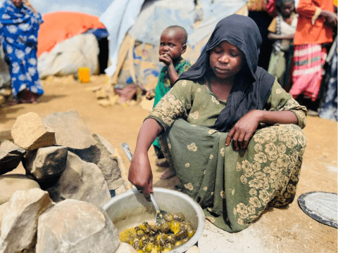 a mother from Somalia preparing food