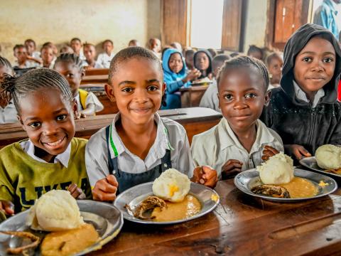 Children with their school meal