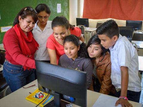group of children using the computer
