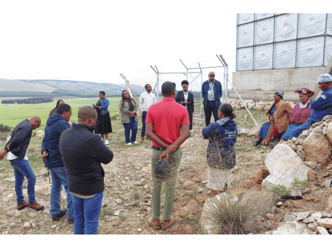 Officials from World Bank interacting with water committee members at a World Vision supported water project site. 