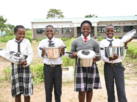 Chrizeria and her friends with their cookware