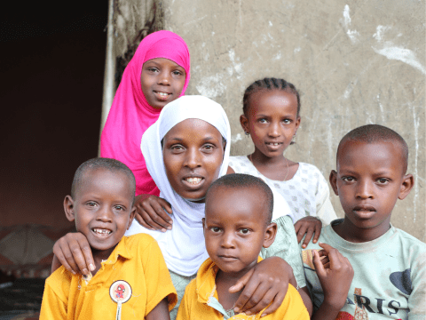 Angatu with her children at her home in Habro Woreda