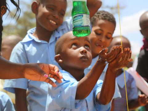 A child learns how to correctly wash hands with water and soap so as to prevent diseases during the 2018 Global Handwashing Day national celebrations held in Kitui County, Kenya. ©2018 World Vision/ Photo by Susan Otieno