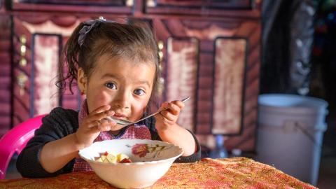 a little girl eating