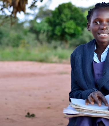 A Mali girl reads a book in Mali
