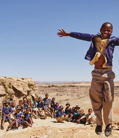 Boy jumping with his arms open